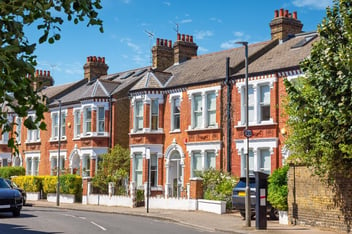 Row of suburban houses representing social housing initiatives supported by the Social Housing Decarbonisation Fund (SHDF).